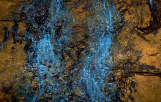 Hydromining in an open pit tin mine